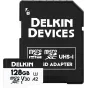 Delkin 128GB microSDXC UHS‑I V30 memory card with full-size SD adapter, displayed in front of its black protective case.