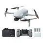 Potensic ATOM 3 drone with remote controller, three batteries, and accessories in a compact travel-ready setup