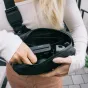 Wandrd D1 Fanny Pack with Fujifilm Instax Mini 12 camera, magnetic buckle, and multiple compartments for travel essentials