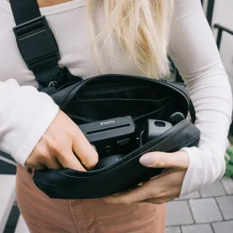 Wandrd D1 Fanny Pack with Fujifilm Instax Mini 12 camera, magnetic buckle, and multiple compartments for travel essentials