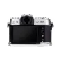 JJC HG XT50 Silver camera hand grip attached to Fujifilm X‑T50, showing rear view with silicone-wrapped grip, Arca-Swiss quick-release base and easy battery access