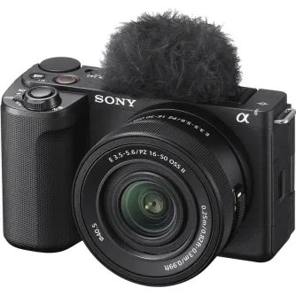 Sony ZV-E10 mirrorless camera with 16-50mm OSS II lens, directional 3-capsule microphone with windscreen adapter, textured grip, vari-angle LCD screen, and red recording indicator light for vlogging and content creation.