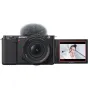 Sony ZV-E10 mirrorless camera with 16-50mm OSS II lens and directional microphone in action