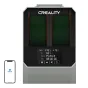 Creality Space Pi Plus filament dryer with a black front panel and green interior, digital display showing temperature and settings, alongside a smartphone displaying the Creaty Good logo.
