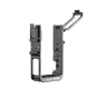 Black metal frame for DJI Action 2 camera featuring a hinge mechanism, multiple mounting points, and ventilation slots. TELESIN branding is visible on the bottom.