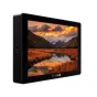 SmallHD Cine 7 7-inch external LCD monitor from the ARRI Kit, displaying a vivid sunset mountain landscape on its high-brightness screen, with a side view showing ports and power button, black anodized aluminum chassis.