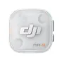 Top view of the DJI Mic Mini 2S transparent charging case, showing the white DJI logo, MINI 2S label, green side indicator, and black side buttons, highlighting the compact wireless lavalier microphone system packaging.
