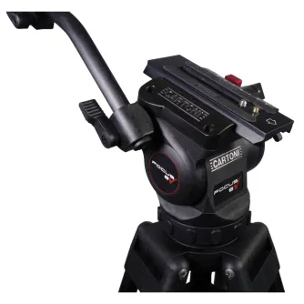 Close-up of Cartoni FOCUS 8 tripod head with red lock mechanism, attached to a 2-stage aluminum tripod. Features include 'FOCUS 8' logo, 'CARTONI' branding, adjustable knobs, and a red locking button. Rubber feet and soft carryi