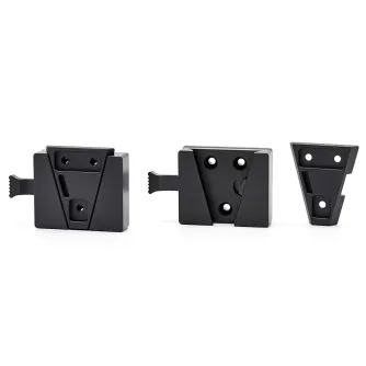 CVW Video VLOCK V-Lock Adapter System - Three black metal V-Lock adapter components: a rectangular plate with a V-shaped cutout and spring mechanism, a plate with four mounting holes, and a triangular plate with two holes, all f