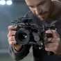 DJI Focus Pro Creator Combo follow focus system with LiDAR module and grip handle, used by a professional cinematographer.