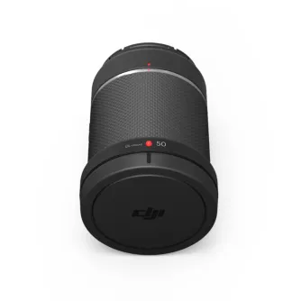 DJI DL 50mm F2.8 prime lens front view with carbon fiber body, red indicator and DL‑mount 50 marking, cap on, DJI logo visible