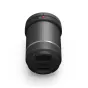 DJI DL 50mm F2.8 LS ASPH lens with carbon fiber barrel, front cap featuring DJI logo, red alignment dot, and '50' marking, top view