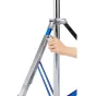 Hand adjusting the clamp on the blue-striped leg of a Kaiser HD 300 light stand, made of chrome-plated steel.