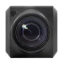 Close-up of a Marshall CV355-10X block camera lens showing internal glass elements and reflections, featuring a black housing with a circular lens mount and a small port on the top left. The lens has concentric rings and a sligh