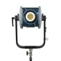 NANLUX Evoke 600C Full-Color LED monolight spotlight mounted on a stand, front view, featuring eight-color mixing, gold mesh diffuser, and control knobs for professional photo, film, and video lighting.