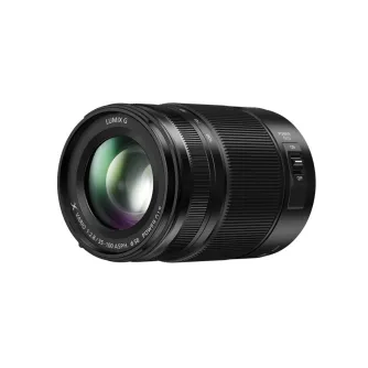 Black Panasonic Lumix G Vario 35‑100 mm F2.8 lens shown front-on with glass element, zoom ring and side power switch, highlighting its compact design and professional optics.