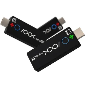 RGBlink ASK nano 4K wireless transmitter with USB-C ports, blue LED indicators, and branding labels, one device positioned diagonally in the foreground and the second partially visible behind it.