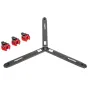Sachtler Flowtech 100 GS carbon fiber video tripod with three legs spread in a Y-shape, brand name visible on each leg and three red and black removable foot accessories beside it