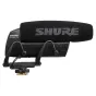 Shure VP83 LensHopper shotgun condenser microphone mounted on a camera, featuring a black foam windscreen with 'SHURE' branding, metallic body, adjustable mounting brackets, and threaded base.