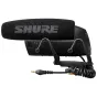 Shure VP83 Condenser Microphone mounted on a camera rig with a shock mount and coiled cable, featuring a foam windscreen, gain control switches, and a 3.5mm output jack.