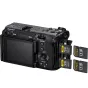 Sony FX3A full-frame cinema camera rear view with open dual media compartment holding two CFexpress/SD cards and two spare SD cards displayed beside it.