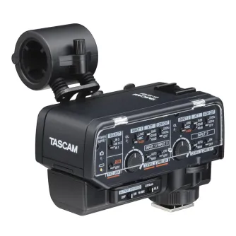 Tascam CA-XLR2d two-channel XLR microphone adapter with cold shoe mount for mirrorless cameras, featuring front panel controls and a transparent protective cover.