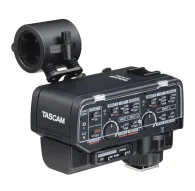 Tascam CA-XLR2d two-channel XLR microphone adapter with cold shoe mount for mirrorless cameras, featuring front panel controls and a transparent protective cover.Tascam CA-XLR2d two-channel XLR microphone adapter with cold shoe mount for mirrorless cameras, featuring front panel controls and a transparent protective cover.