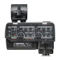Tascam CA-XLR2d two-channel XLR microphone adapter with preamps, front view showing control knobs, switches, and cold shoe mount for mirrorless cameras