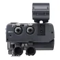 Rear view of the Tascam XLR microphone adapter, featuring INPUT 1 and INPUT 2 XLR connectors with push-button caps, INPUT 3 3.5 mm jack, cold-shoe mount, and cable ports, designed for mirrorless camera audio.