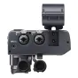 Aizmugures skats uz Tascam CA‑XLR2D divu kanālu XLR mikrofonu adapteri Canon bezspoguļu kamerām, rādot Input 1 un Input 2 XLR ieejas ar pogām, Input 3 3,5 mm ieeju, noņemamās vāciņus un aukstā pēda montāžu.
