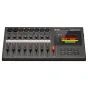 Close-up of the Zoom R20 Multi Track Recorder's front panel, featuring 16 XLR/TRS input jacks, 16 gain knobs with color-coded labels, 16 track volume faders, a red master fader, and a 4.3" LCD touchscreen displaying a multitrack