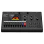 Close-up of the Zoom R12 Multi Track Recorder's front panel showing the touchscreen display, 18 channel faders, effect knobs, and playback controls. The device is powered on, displaying a waveform with red and yellow tracks. Inp