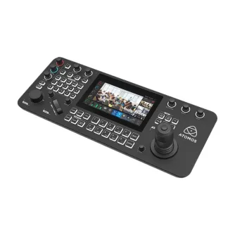 Atomos A-Eye Controller PRO - Ergonomic PTZ controller with a 7-inch HD touchscreen displaying a live camera feed of a group of people in a room, featuring control buttons, dials, and a joystick.