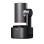 Sleek OBSBOT Tail 2 NDI camera with a cylindrical body, gimbal arm, and 5x optical zoom, mounted on a black base with red accents, featuring ventilation slots and a power indicator light, displayed against a white background.
