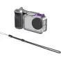 SmallRig modular street photography kit for DJI Osmo Action 6, featuring a silver cage with purple accents, a black side handle, and a black braided wrist strap.
