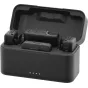 GoPro Wireless Mic Complete Kit open charging case containing two clippable transmitters, USB-C and 3.5 mm receivers, and a control module with mode button and gain dial.