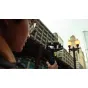 GoPro Wireless Mic Complete Kit microphone attached to a handheld gimbal camera with a windscreen, ideal for urban video production