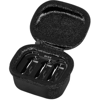 Open black zippered Rode Wireless GO Charge Case+ with foam interior holding two transmitters and one receiver for simultaneous charging.