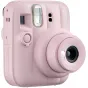 Канди‑пинк Fujifilm Instax Mini 13 instant camera с выдвинутым 60 мм объективом, встроенной вспышкой, таймером для селфи и брендингом на передней панели.