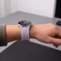 Tech-Protect periwinkle braided nylon watch strap for Samsung Galaxy Watch 40/44/46 mm, adjustable and breathable, worn on a wrist with a minimalist analog watch face.