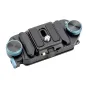 Fotopro RZ-5 backpack quick-release mounting bracket, black metal body with two blue knurled knobs, top view showing the sliding slot and central screw, designed for attaching cameras to backpack straps or hip belts.