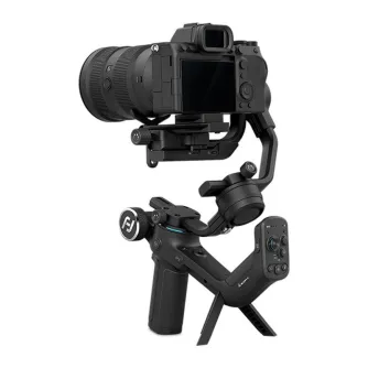 FeiyuTech Scorp-C handheld gimbal with DSLR camera mounted, ergonomic dual-handle design, remote control, fold-out tripod and lens support, black finish, up to 2.5 kg load and 13 h battery life.