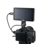 Godox GM6S Pro 4K Ultra Bright 5.5" camera monitor mounted on a mirrorless camera via HDMI, screen off, on a tripod.