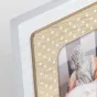 Premium Zep Yoghi wooden baby photo frame 10x15 cm with a natural baby look, white polka-dot border, surface-display design, featuring a baby in a knitted hat.