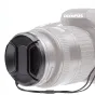 Kaiser 77mm snap-on lens cap with a loss-prevention cord attached to an Olympus camera lens