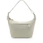 Peak Design City Crescent 12L shoulder bag in moon color, featuring an ergonomic crescent shape, front zippered pocket with pull tab, and adjustable strap.
