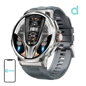 Colmi V69 sudra smartājas ar melnu silikonu strapu, 1,85‑polzu HD ekrānu, kas parādītas laiks, pulss, akuma un weather, pie COLMI smartfonu ikonas, kas norāda Bluetooth saviesu.