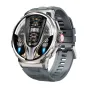 Colmi V69 sudrabs smartwatch ar metalu kāsu un melnu silikona joslā, 1,85‑inčis HD ekrāns parādīts ar laiku, akumulatoru, soliem un temperatūru, sarkanā krāsas krūtiņa.